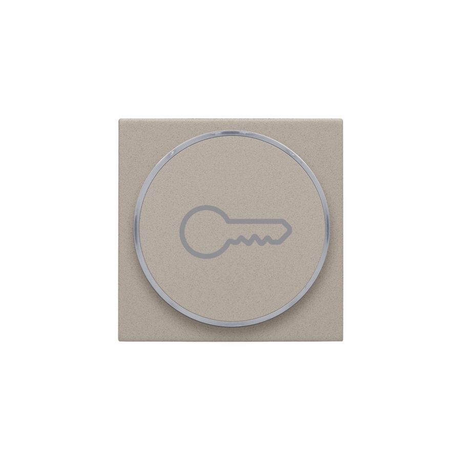 Afwerkingsset met doorschijnende ring met sleutelsymbool voor drukknop claystone textured